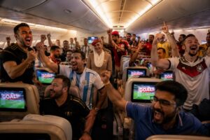 Emirates World Cup Live passengers watching FIFA World Cup Final on ICE entertainment system at 40,000 feet
