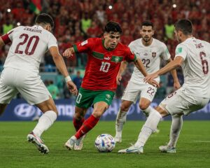 Morocco World Cup Semi-Final hopes with Achraf Hakimi and Morocco national football team celebrating before facing France